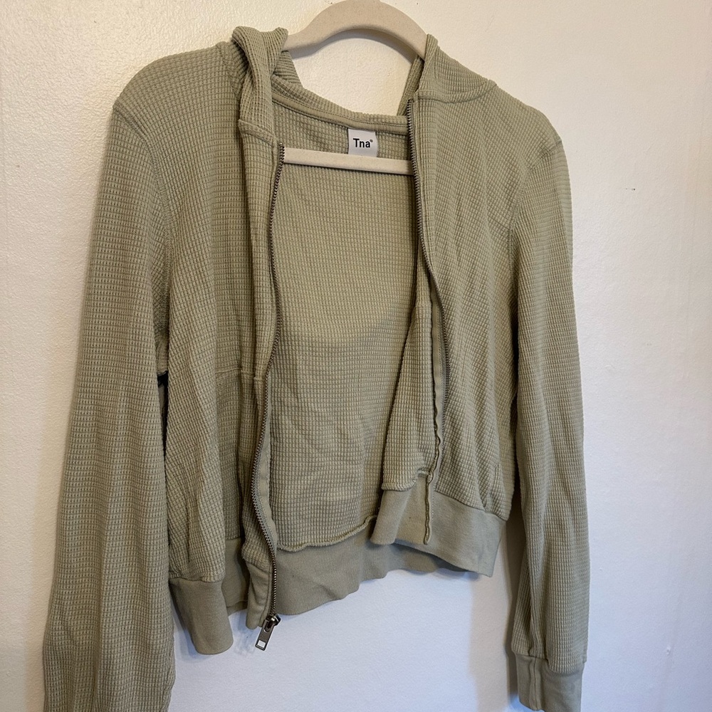 TNA zip up
